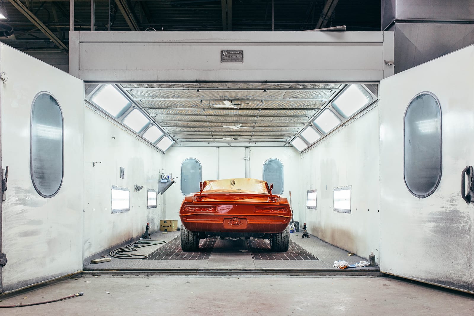 A car being refinished in the paint booth at A1 Automotive Center, a collision and auto body shop in Hilo, Hawaii